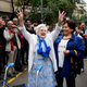 Woman applauded for voting at Catalan polling place on October 1st. Image via AP.